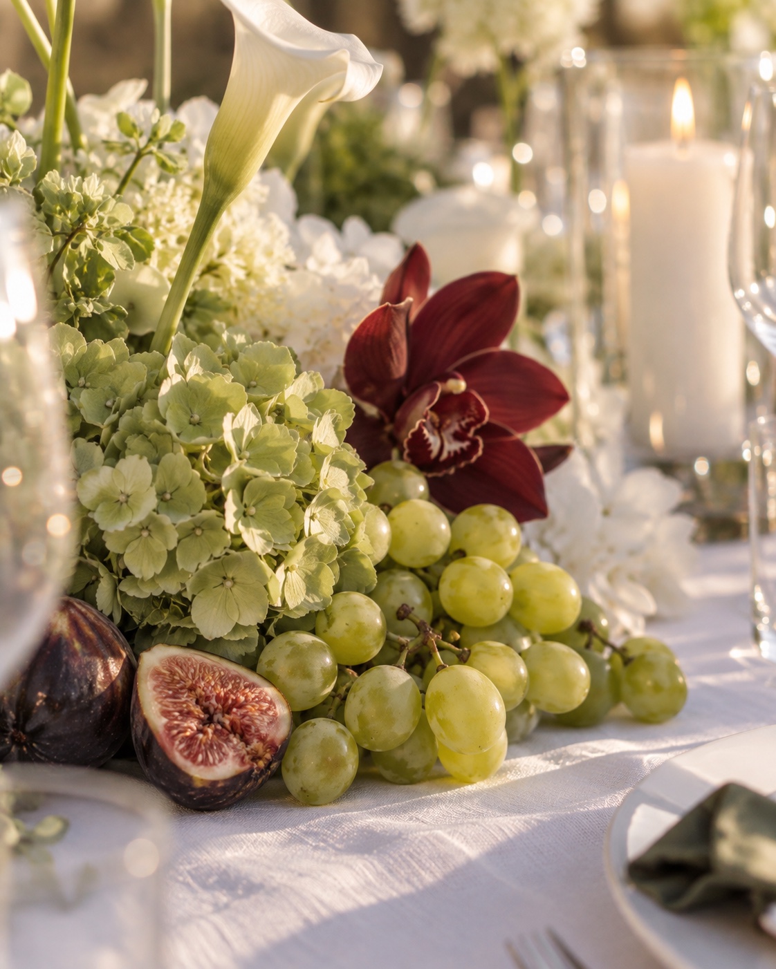 Hydrangea, calla lily, orchid, grape and fig detail from the same engagement party table