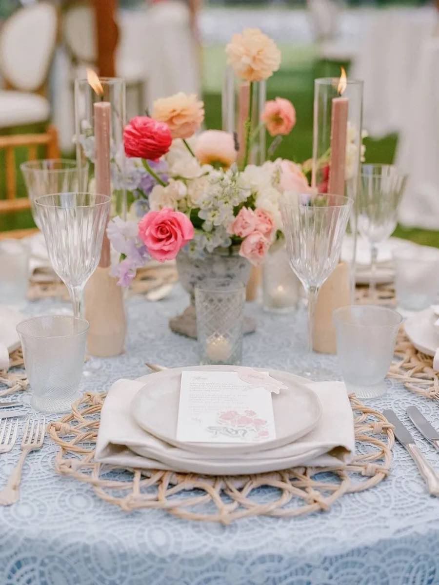 A luncheon table arranged with flowers and glassware