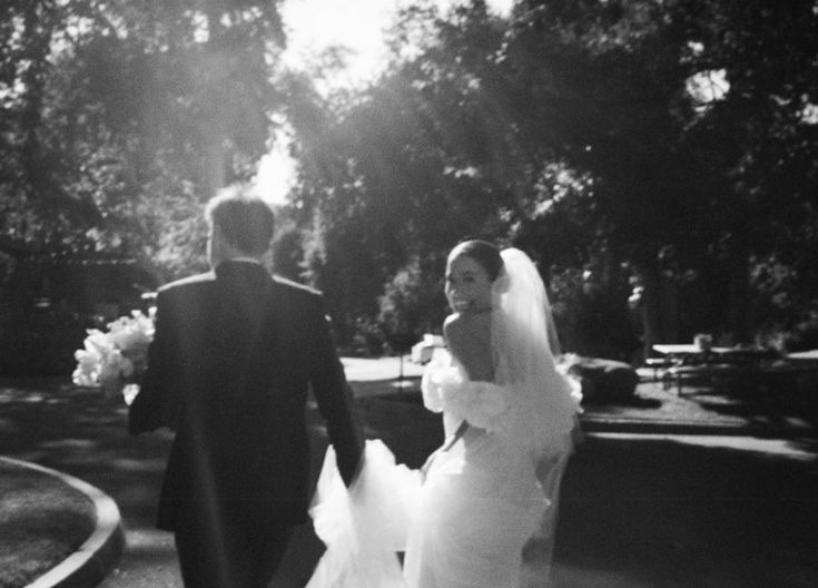Newlyweds walking away together in soft focus